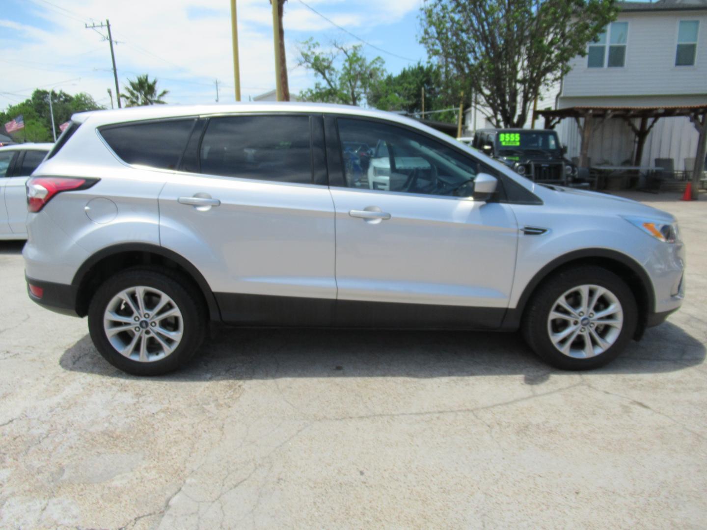 2017 Silver /Black Ford Escape SE FWD (1FMCU0GDXHU) with an 1.5L L4 DOHC 16V engine, Automatic transmission, located at 1511 North Shepherd Dr., Houston, TX, 77008, (281) 657-1221, 29.798361, -95.412560 - 2017 FORD ESCAPE SE VIN: 1FMCU0GDXHUE54105 1 F M C U 0 G D X H U E 5 4 1 0 5 4 DOOR WAGON/SPORT UTILITY 1.5L I4 F DOHC 16V GASOLINE FRONT WHEEL DRIVE - Photo#15